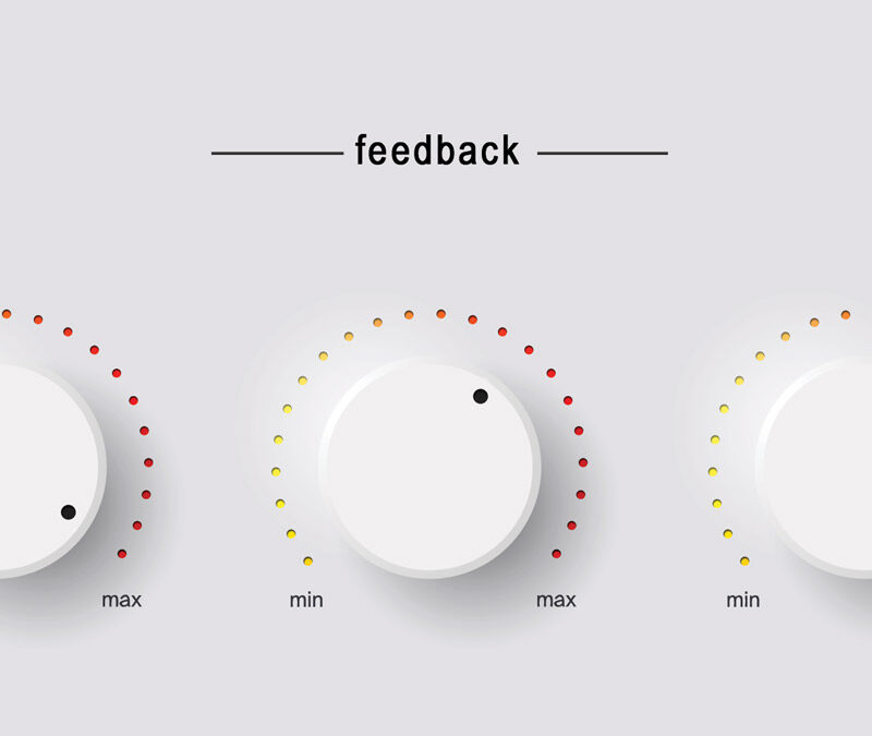 Image of three white knobs labeled feedback above. Each knob has a scale from min to max with red, yellow, and orange dots indicating levels. The knobs are turned to different positions along the scale.
