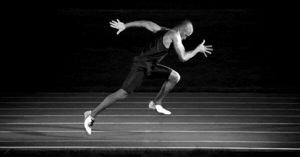 Track Athlete Sprinting at Maximum Velocity