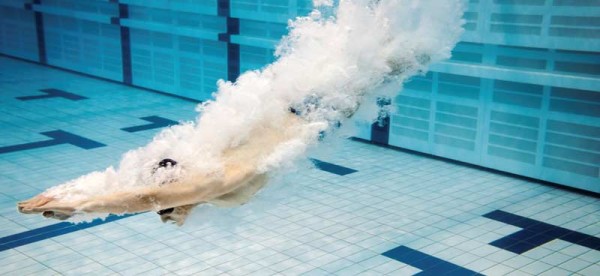 Swimmer Diving into Pool